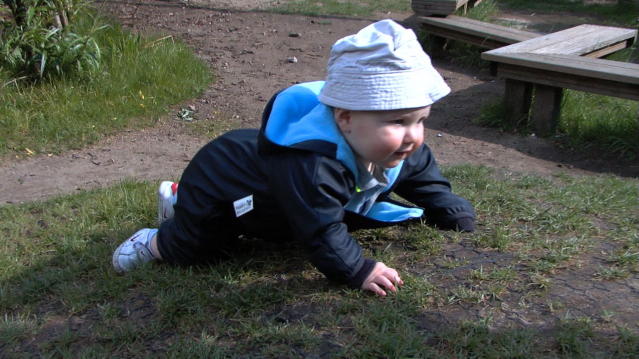 10 months: In nursery garden enjoying movement and exploration.
